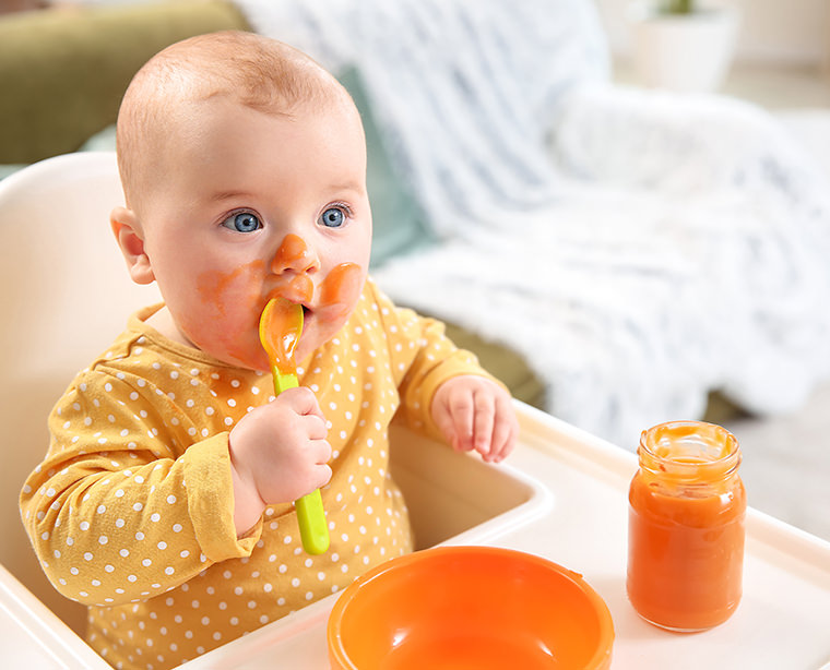 At what age should you begin introducing baby to solid foods?